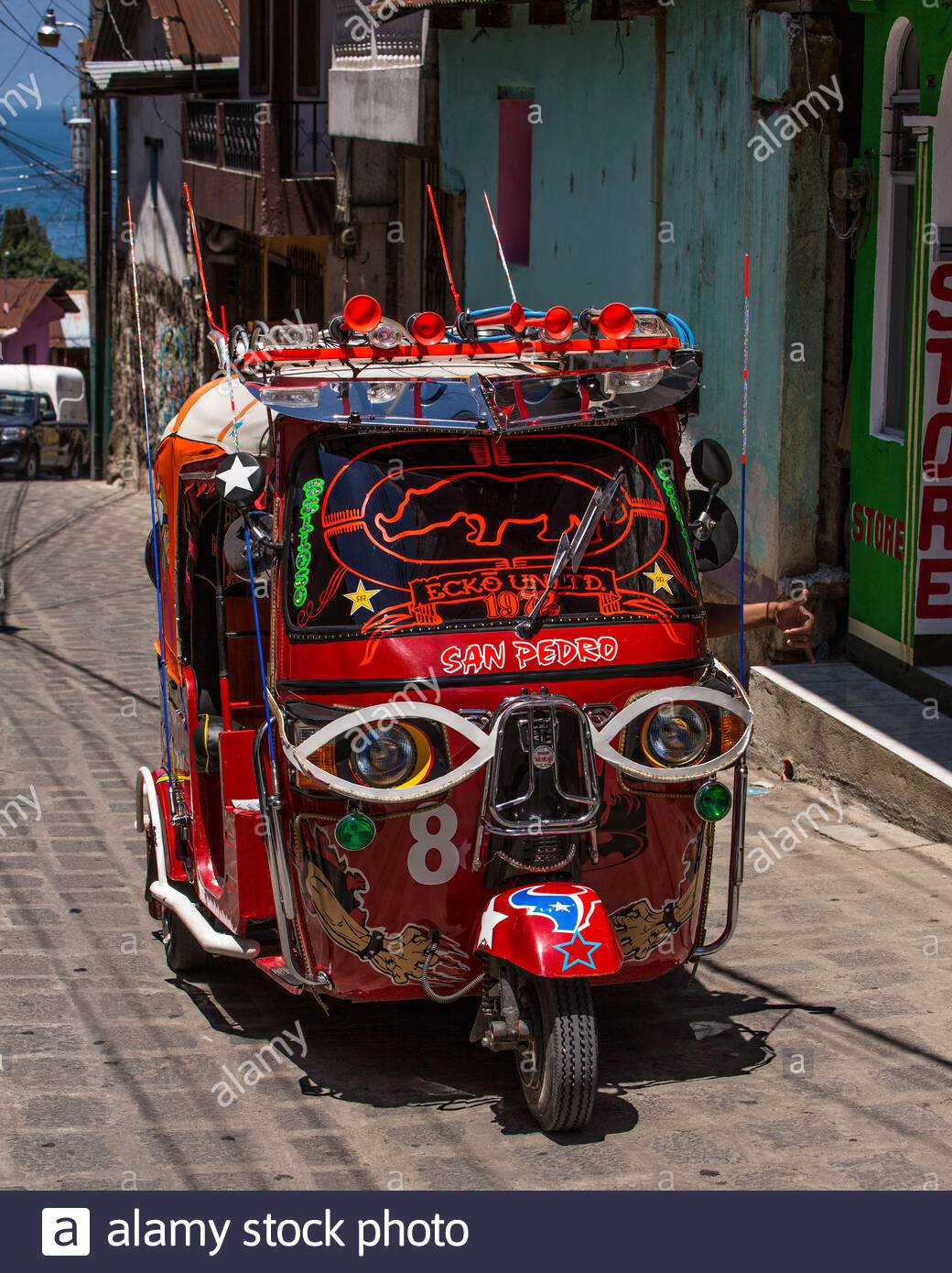 a-highly-decorated-and-customized-tuk-tuk-or-mototaxi-in-san-pedro-la-laguna-guatemala-mototax...jpg