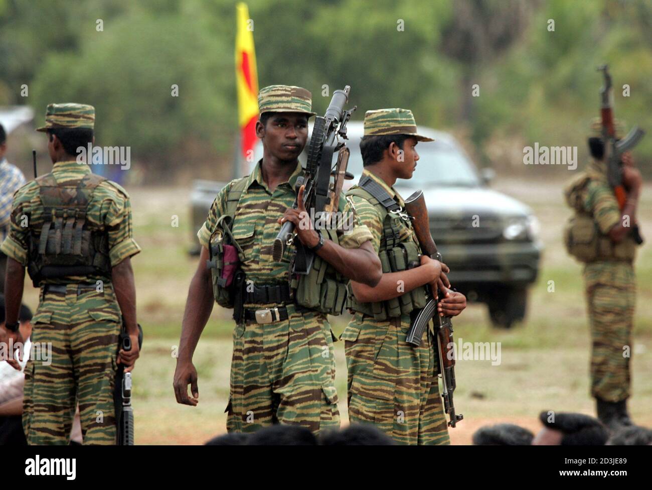sri-lankan-tamil-tiger-rebels-stand-watch-during-a-black-tigers-day-ceremony-to-commemorate-ta...jpg