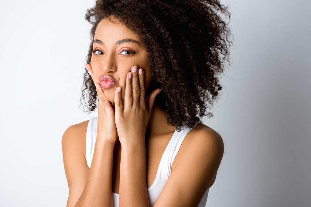 stock-photo-portrait-beautiful-happy-african-american-girl-making-funny-grimace-isolated.jpeg