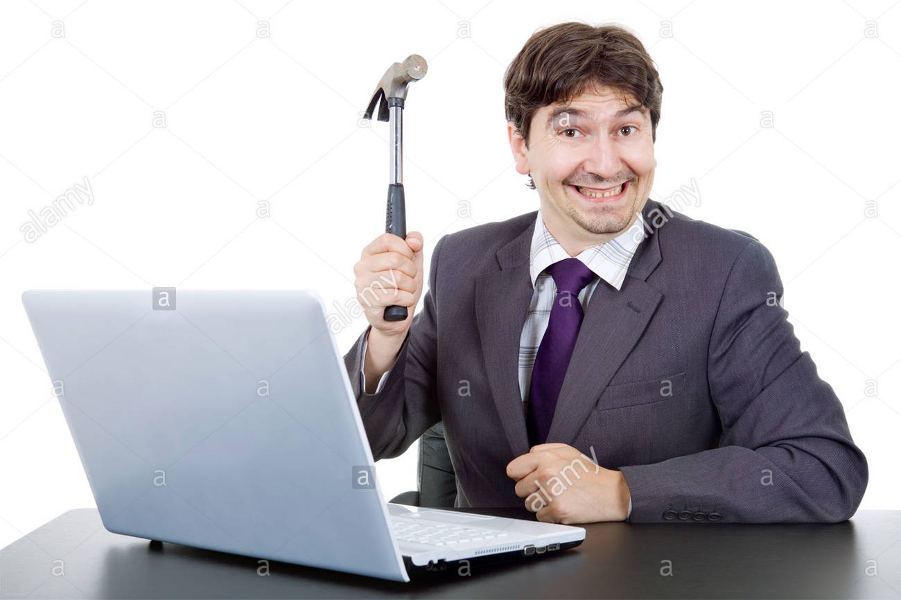 young-crazy-business-man-with-a-hammer-smashing-a-laptop-D76J4T.jpg
