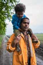 father-expressing-fondness-to-his-kid-holding-him-shoulders-waist-up-prtrait-view-happy-multir...jpg