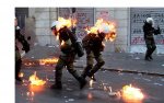 Greek policemen on fire.jpg