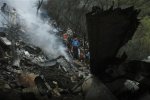 1450914790-pakistani-rescue-workers-examine-site-plane-crash-islamabad-pakistan-wednesday.jpg