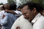 295153921-relatives-mourn-deaths-family-members-killed-plane-crash-outside-local.jpg
